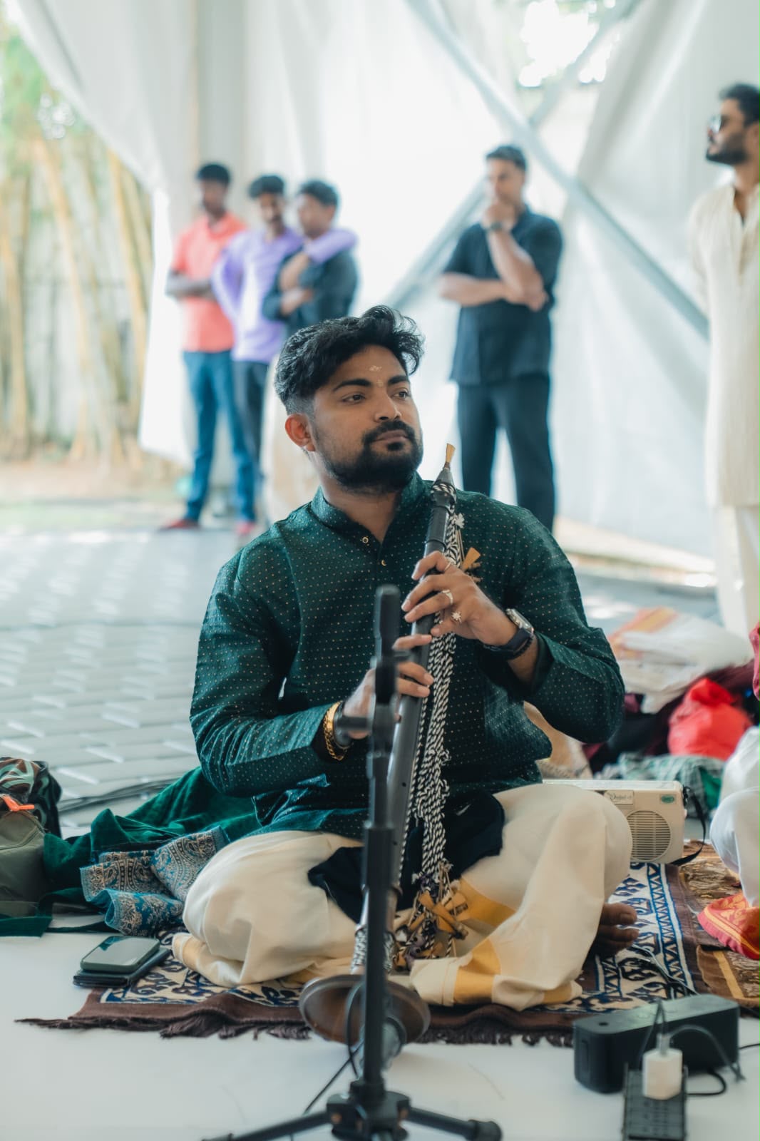 Akhil performing at an outdoor pandal